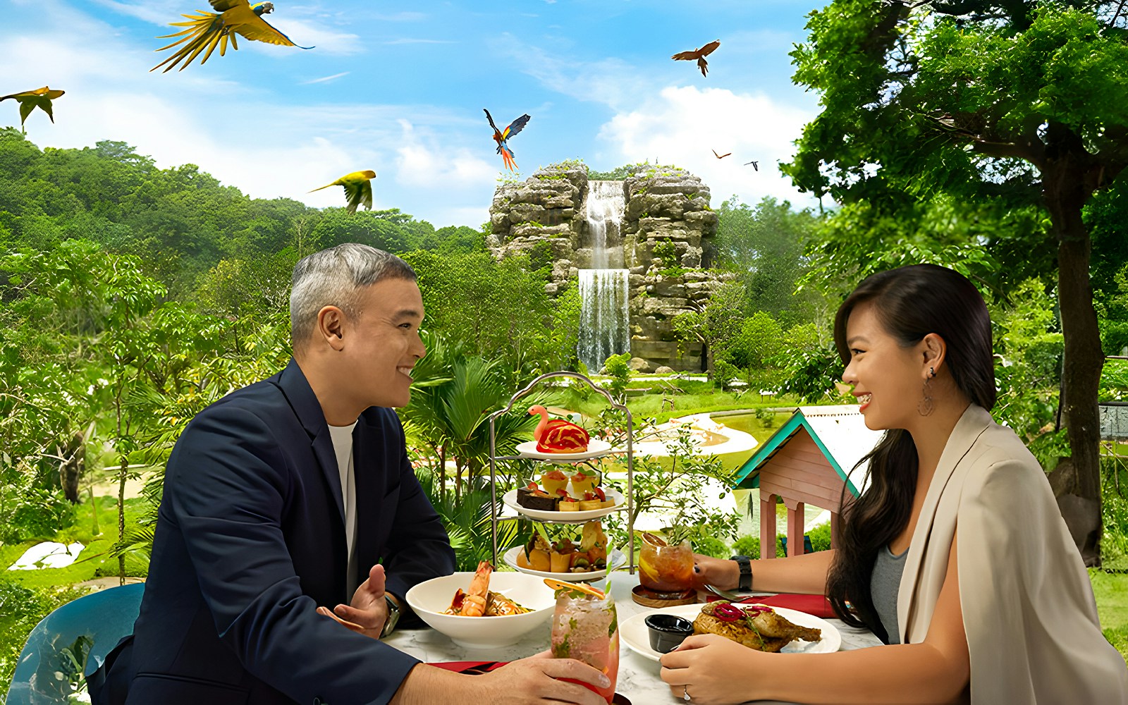 Couple dining outdoors with birds flying and a waterfall in the background at Singapore Zoo.
