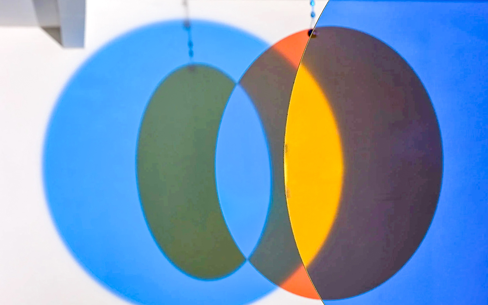 Colorful overlapping circles exhibit at Light Art Museum.