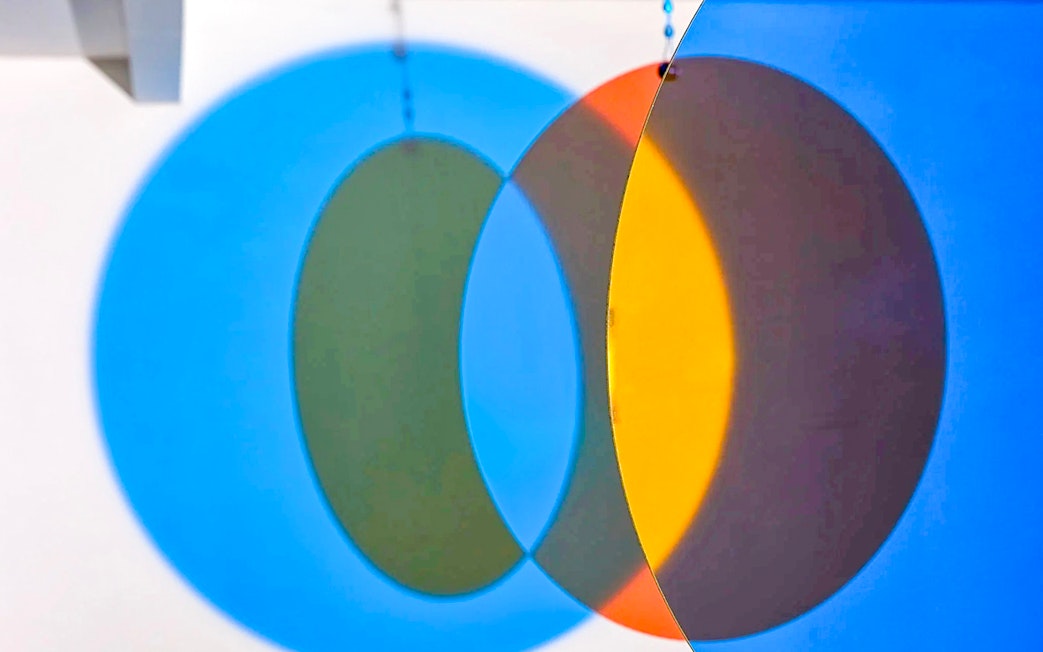 Colorful overlapping circles exhibit at Light Art Museum.