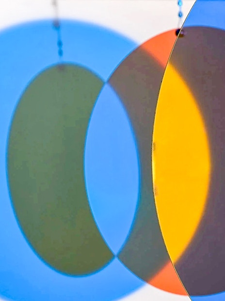 Colorful overlapping circles exhibit at Light Art Museum.
