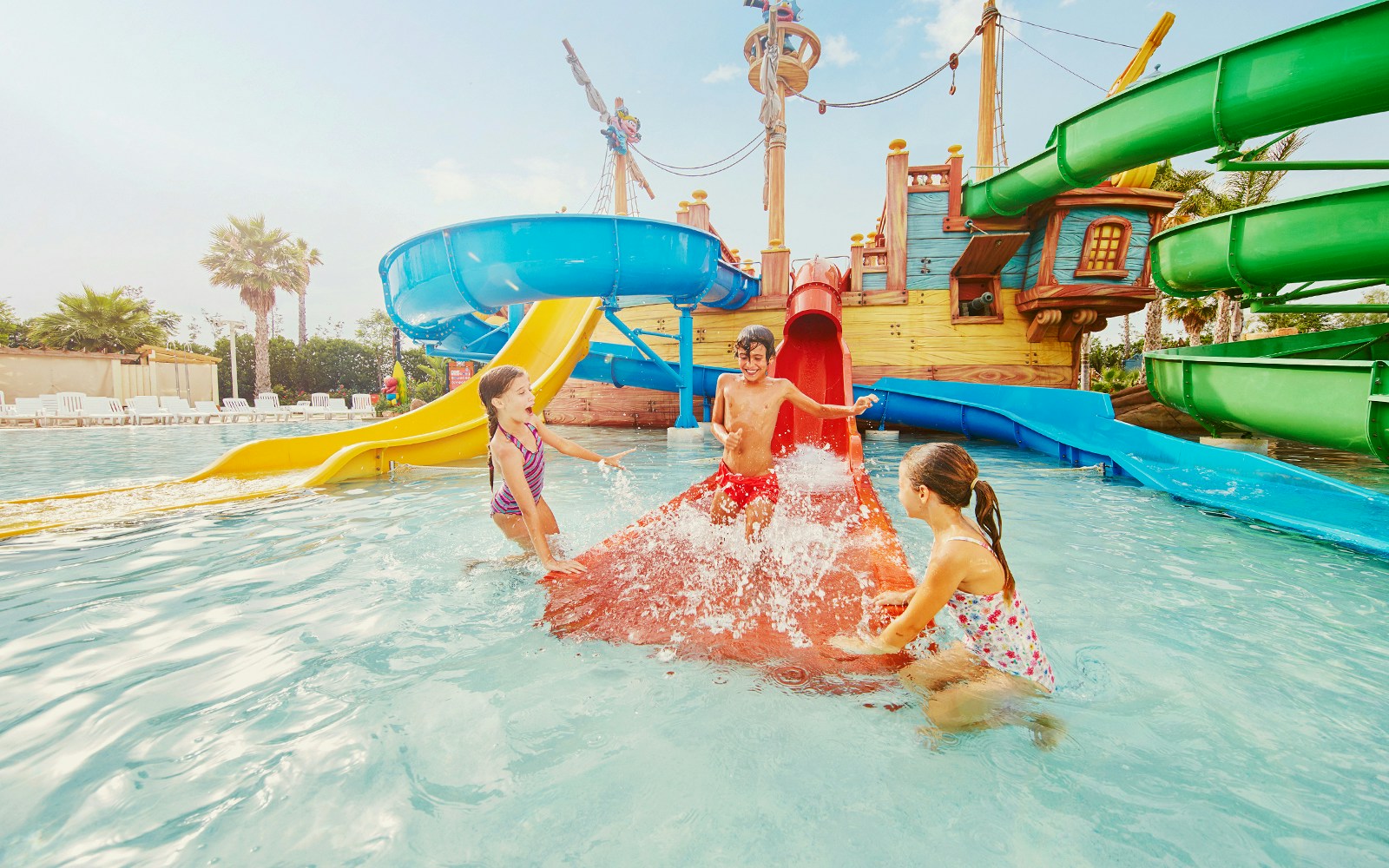 Children playing in water at Costa Caribe Aquatic Park, Barcelona.