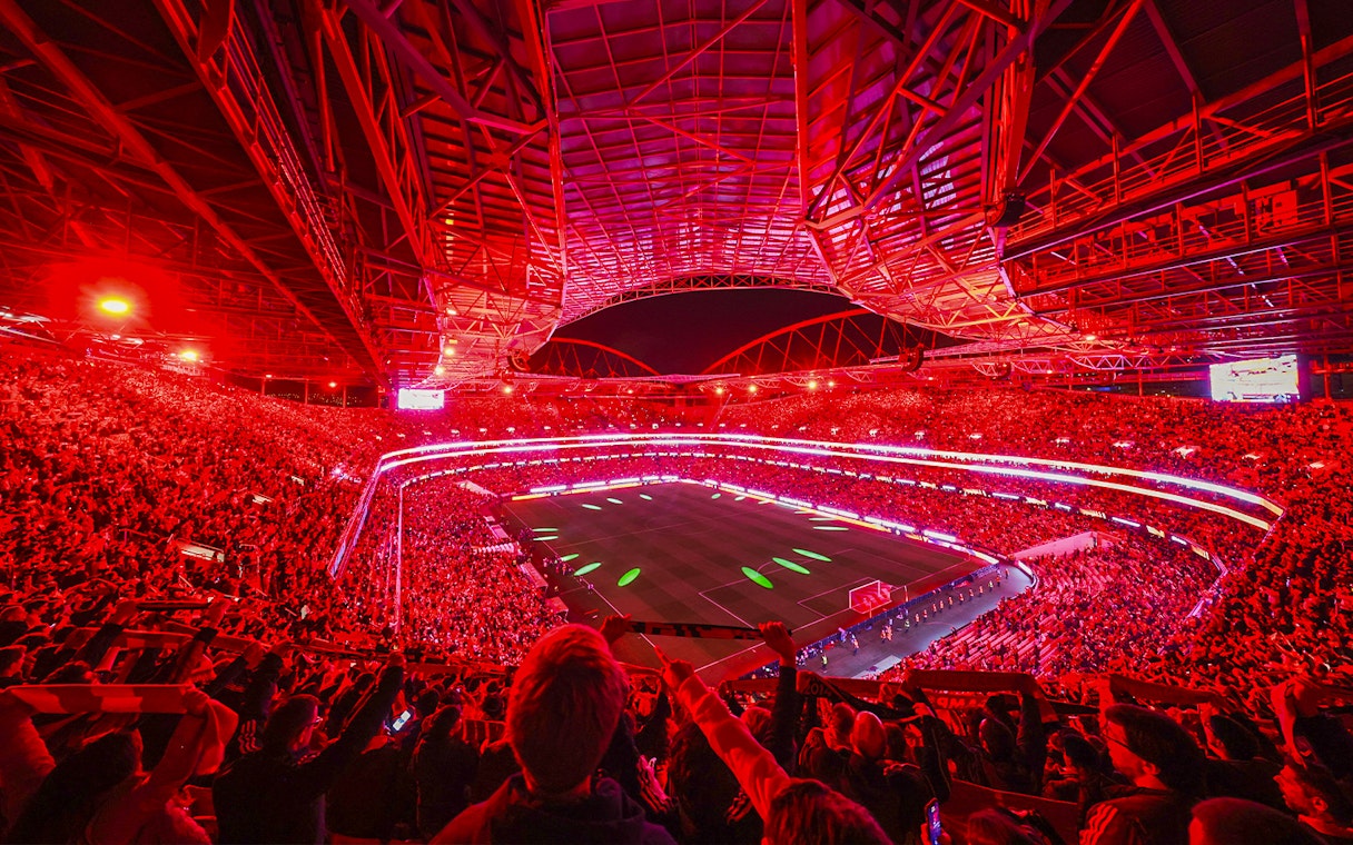 Benfica Stadium illuminated in red during a match light show, Lisbon, Portugal.