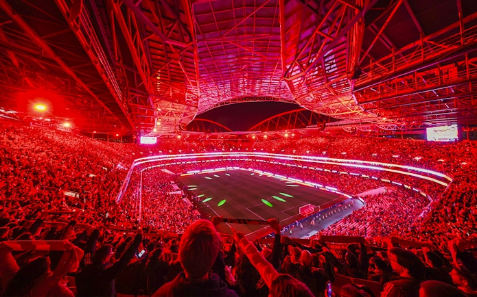 Benfica Stadium illuminated in red during a match light show, Lisbon, Portugal.
