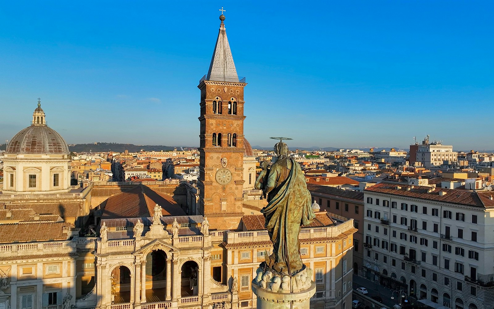 Aerial view of Basilica Santa Maria Maggiore and Rome skyline.