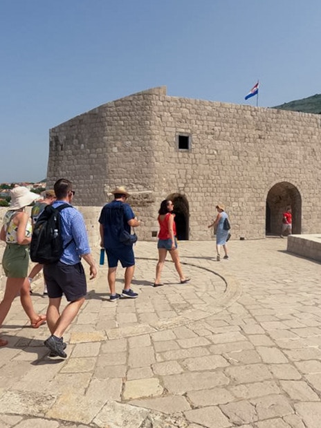 Guests walking along Dubrovnik's historic walls, exploring Game of Thrones filming location.