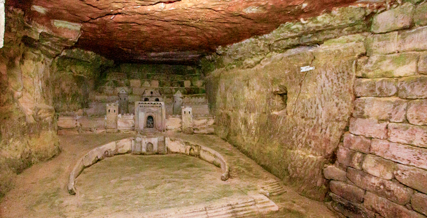Paris Catacombs model of Port-Mahon carved into limestone wall.