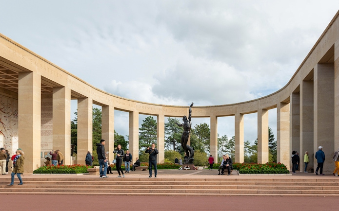 Visitors at Normandy American Cemetery memorial, WWII D-Day tour from Paris.