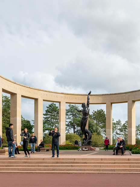 Visitors at Normandy American Cemetery memorial, WWII D-Day tour from Paris.