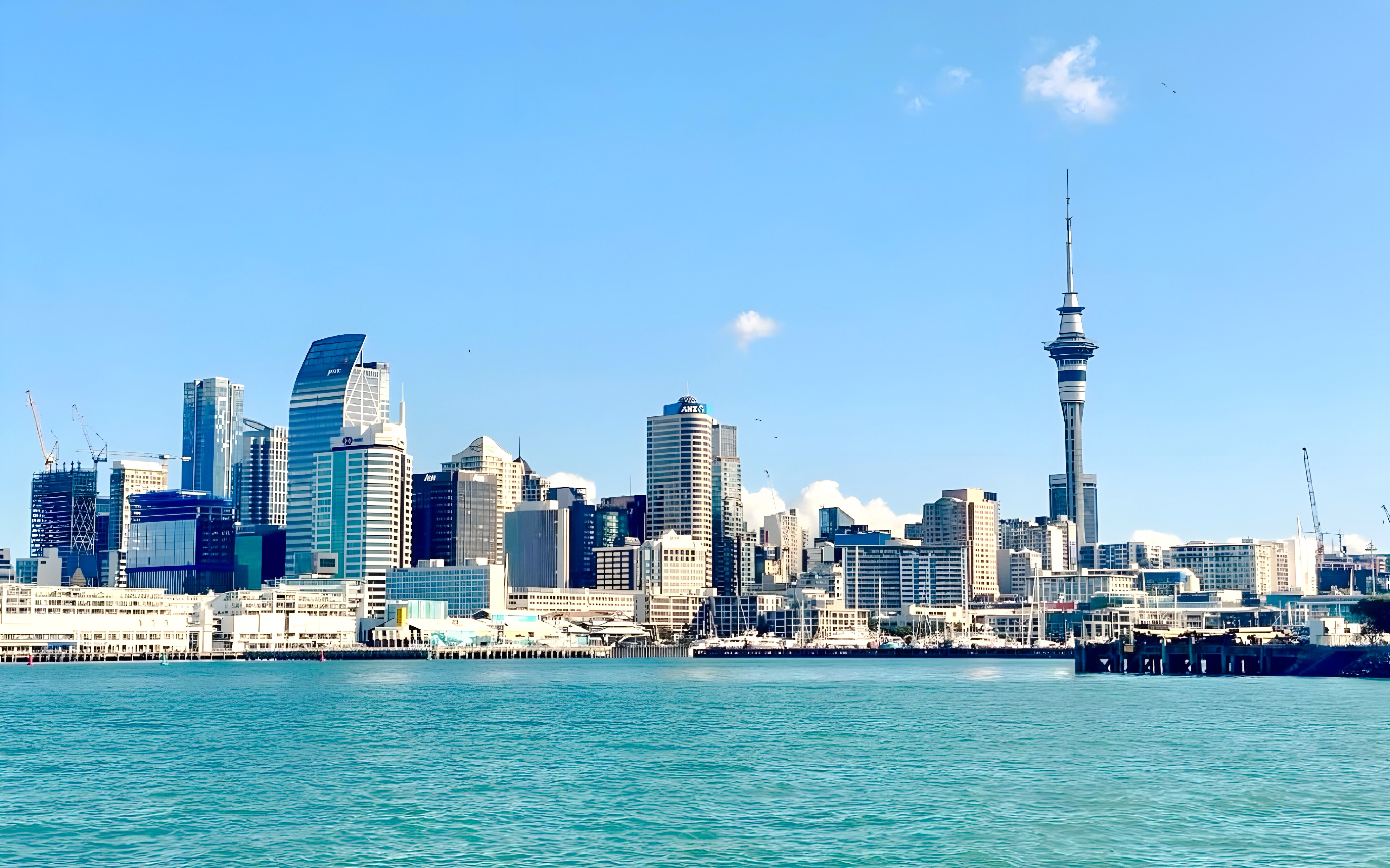 Auckland skyline with Sky Tower viewed from the harbor during a wine and cheese cruise.