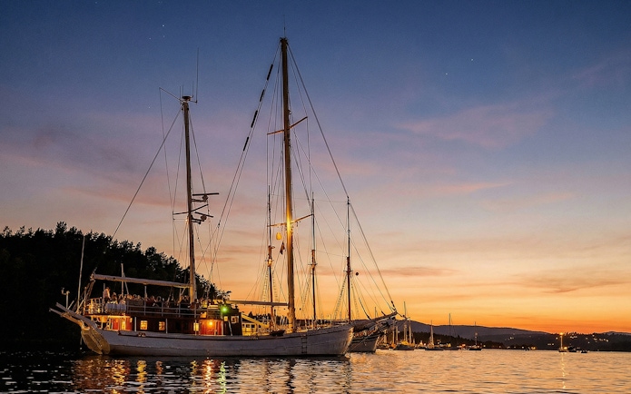 Sailing ship on Oslofjord during evening seafood dinner cruise.
