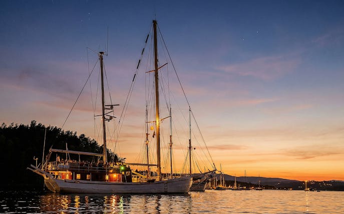 Sailing ship on Oslofjord during evening seafood dinner cruise.