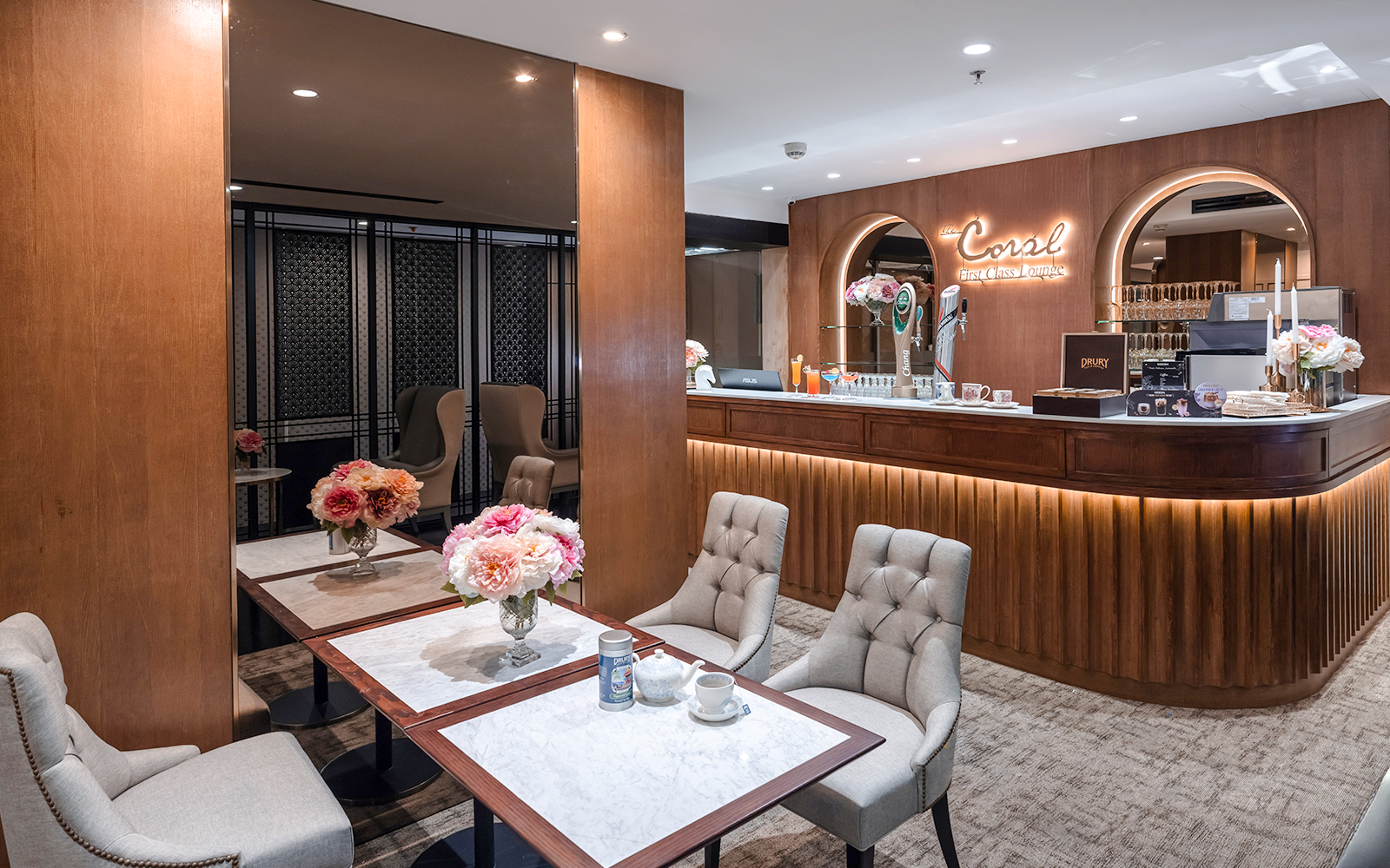 Coral First Class Lounge seating area and bar, Bangkok airport, Thailand.