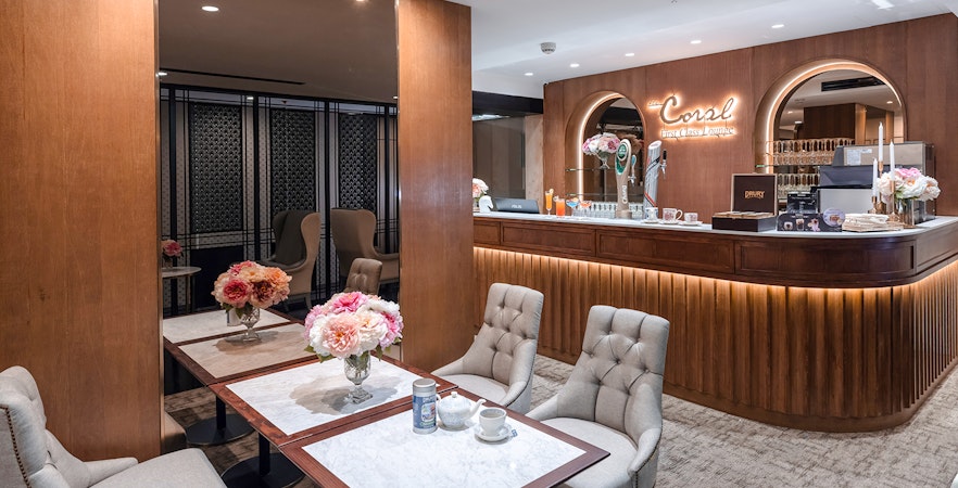 Coral First Class Lounge seating area and bar, Bangkok airport, Thailand.