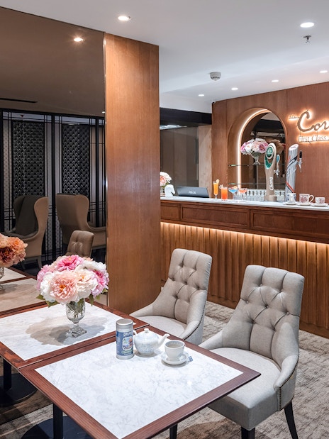 Coral First Class Lounge seating area and bar, Bangkok airport, Thailand.