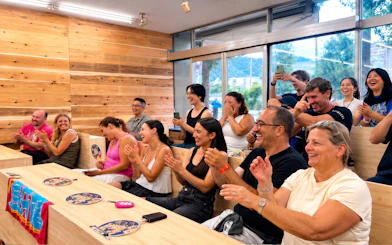 Audience cheering during a live sumo show in Kyoto.