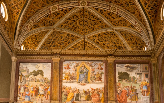 Interior of Church of San Maurizio, Milan, with frescoes and detailed architecture.