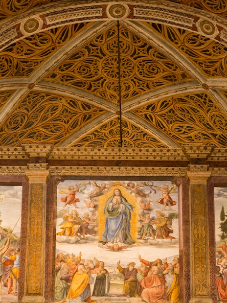 Interior of Church of San Maurizio, Milan, with frescoes and detailed architecture.