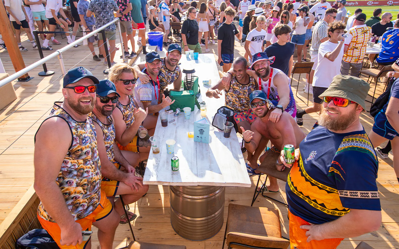 Group enjoying drinks at Emirates Dubai 7s Sunroom Hospitality area.