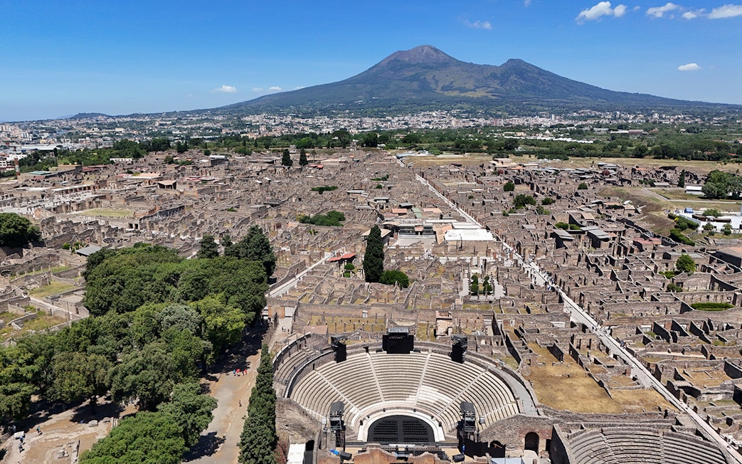 Aerial view of Pompeii Ruins with Mount Vesuvius in the background, Naples.