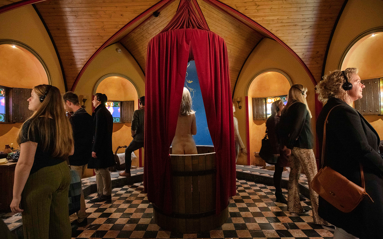 A woman inside a bathouse of medivial times