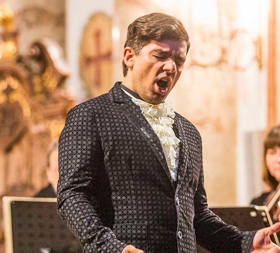 Opera singer performing at St. Charles Church concert in Vienna.