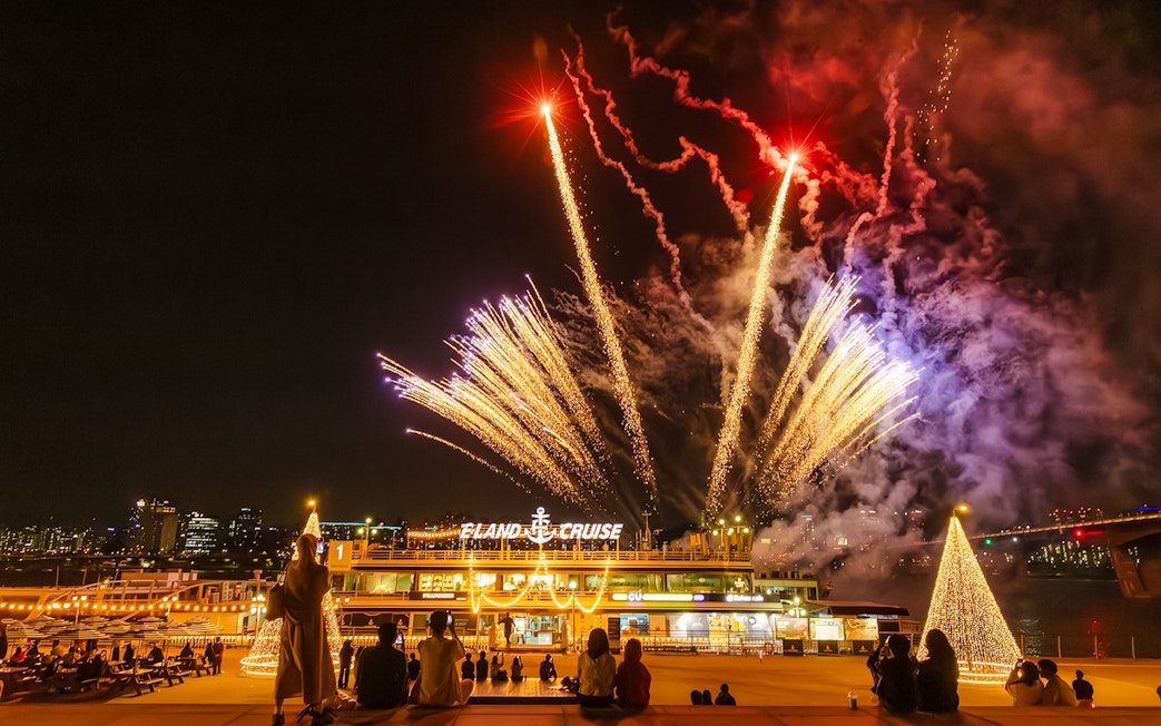 Fireworks display over Eland Cruise ship in Seoul at night.