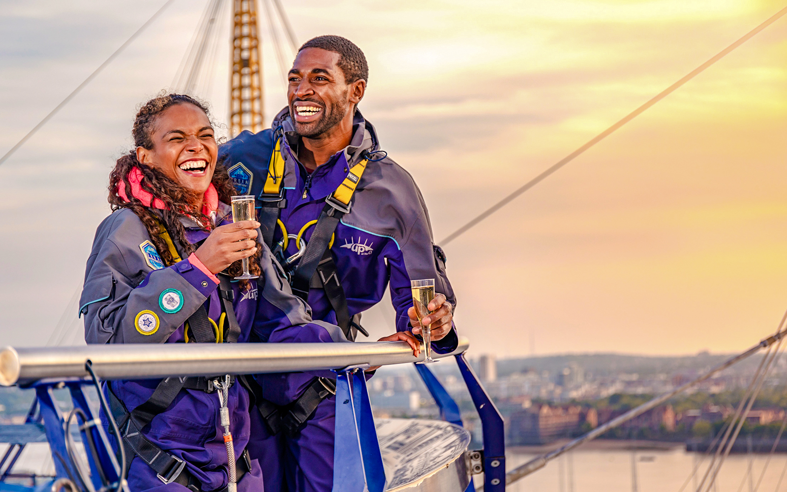 Guests enjoying drinks on Up at the O2 Celebration Climb at sunset.