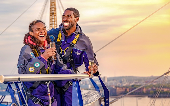 Guests enjoying drinks on Up at the O2 Celebration Climb at sunset.
