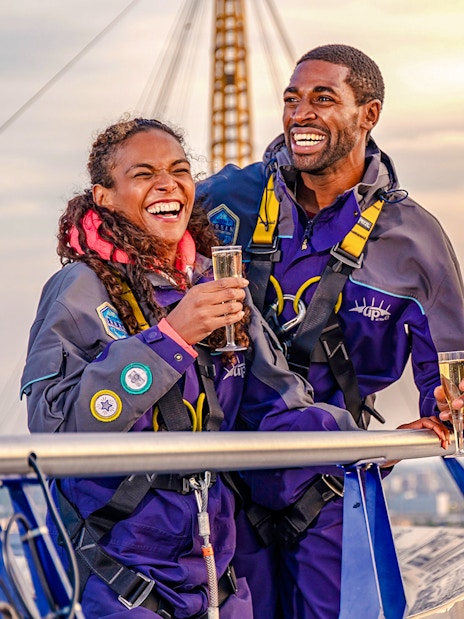 Guests enjoying drinks on Up at the O2 Celebration Climb at sunset.