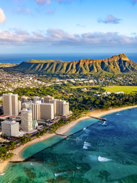 Waikiki skyline with Diamond Head and Queen Kapiolani Regional Park in Honolulu, Hawaii.