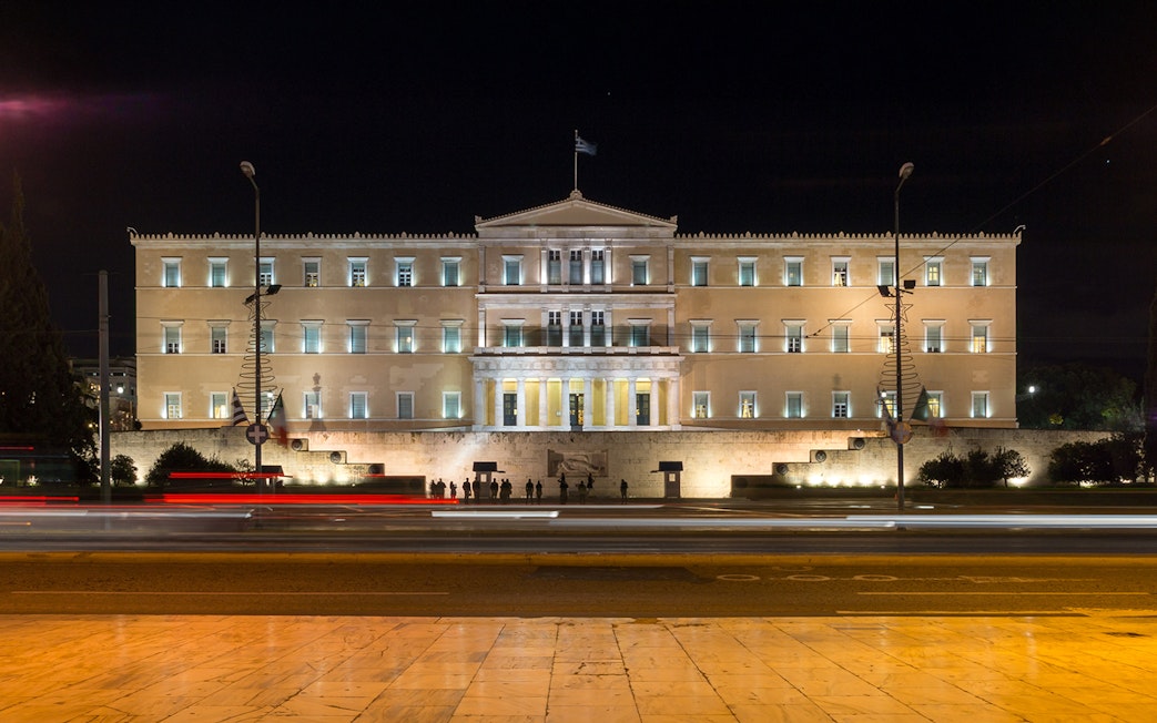 Greek Parliament building illuminated at night, Athens, Greece.
