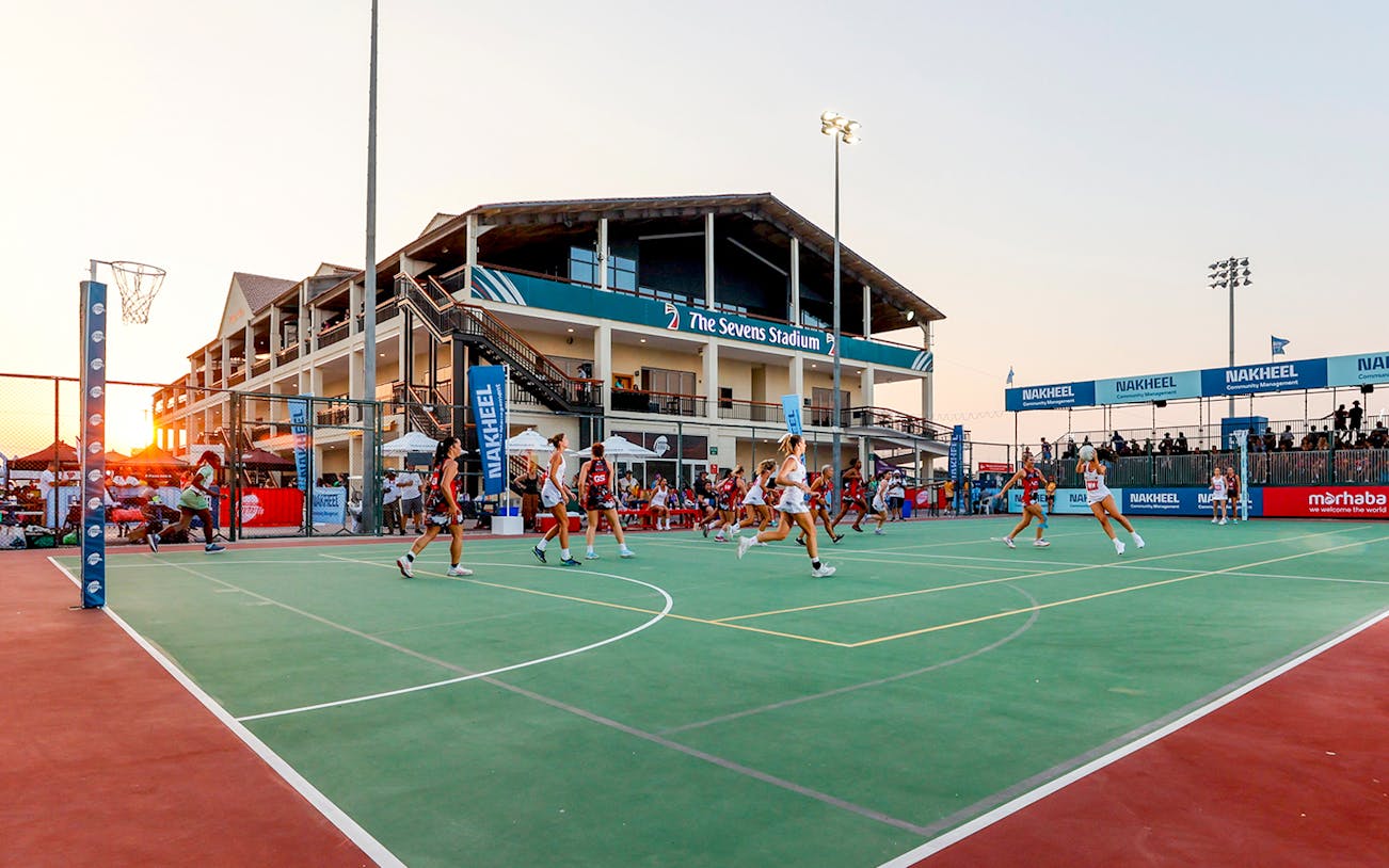 Players on a netball court at The Sevens Stadium during Emirate's Dubai 7's event.
