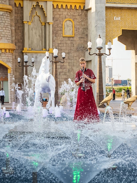 Fountain and performer at Global Village entrance, Dubai.