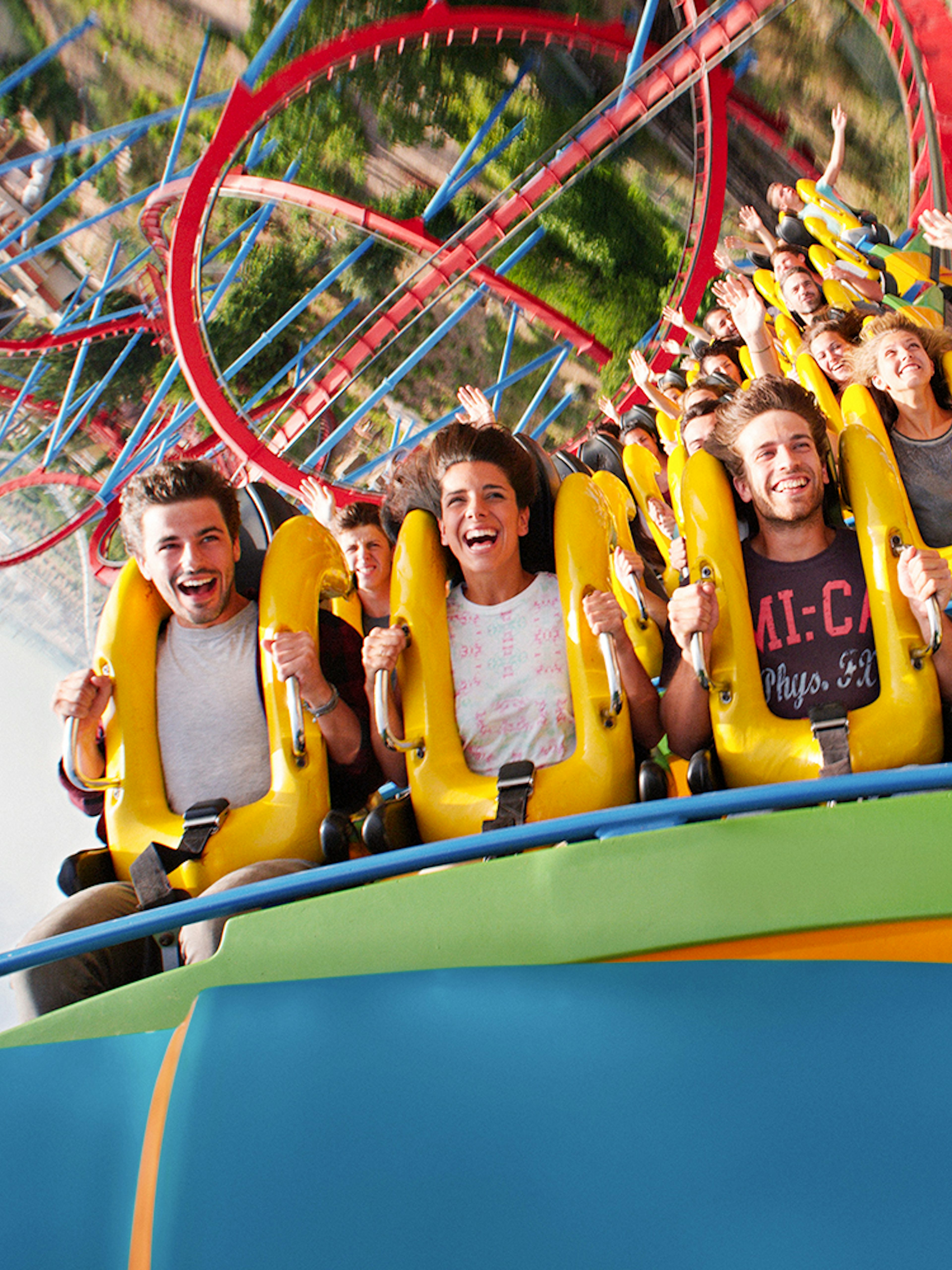 People enjoying a roller coaster ride at PortAventura, Spain.