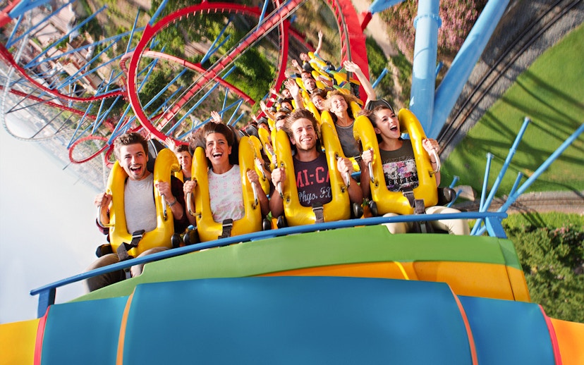 People enjoying a roller coaster ride at PortAventura, Spain.