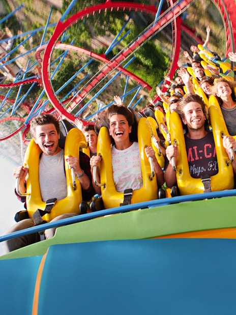 People enjoying a roller coaster ride at PortAventura, Spain.