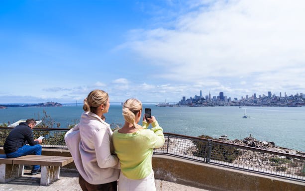 Guests viewing San Francisco skyline from Alcatraz Island.