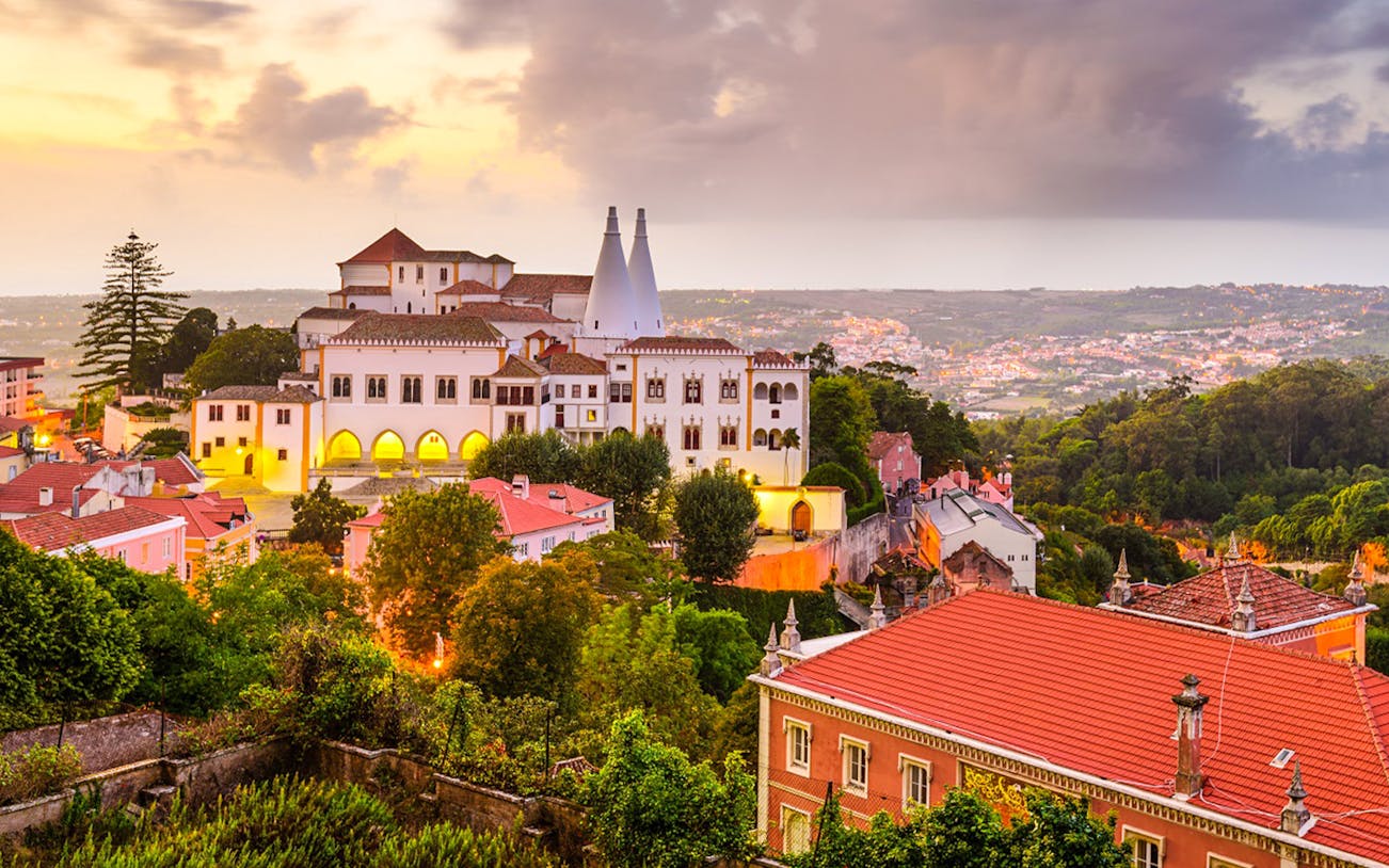 Sintra National Palace at sunset with surrounding landscape, Portugal.