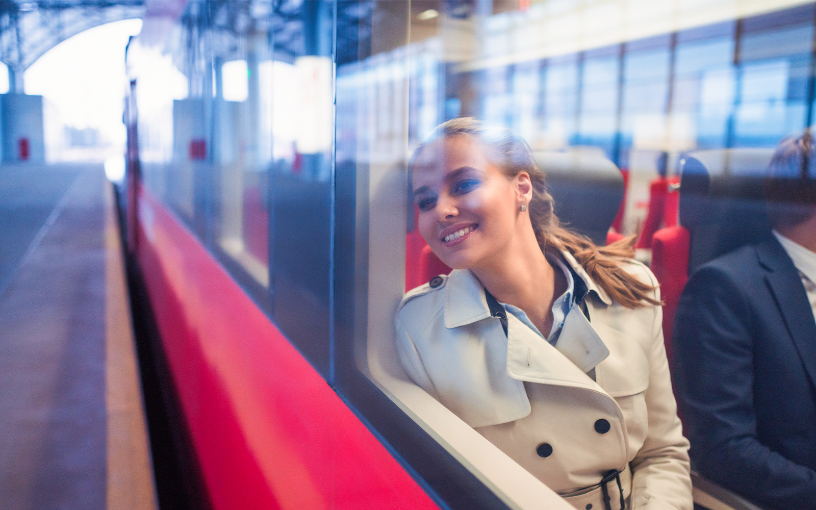 Passenger enjoying a scenic boat tour on the Seine River, Paris, with iconic Eiffel Tower in the background.