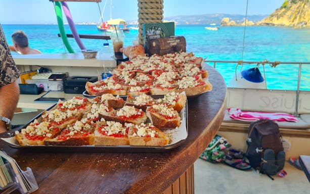 Buffet spread on a dreamy cruise from Kefalonia with scenic ocean view.