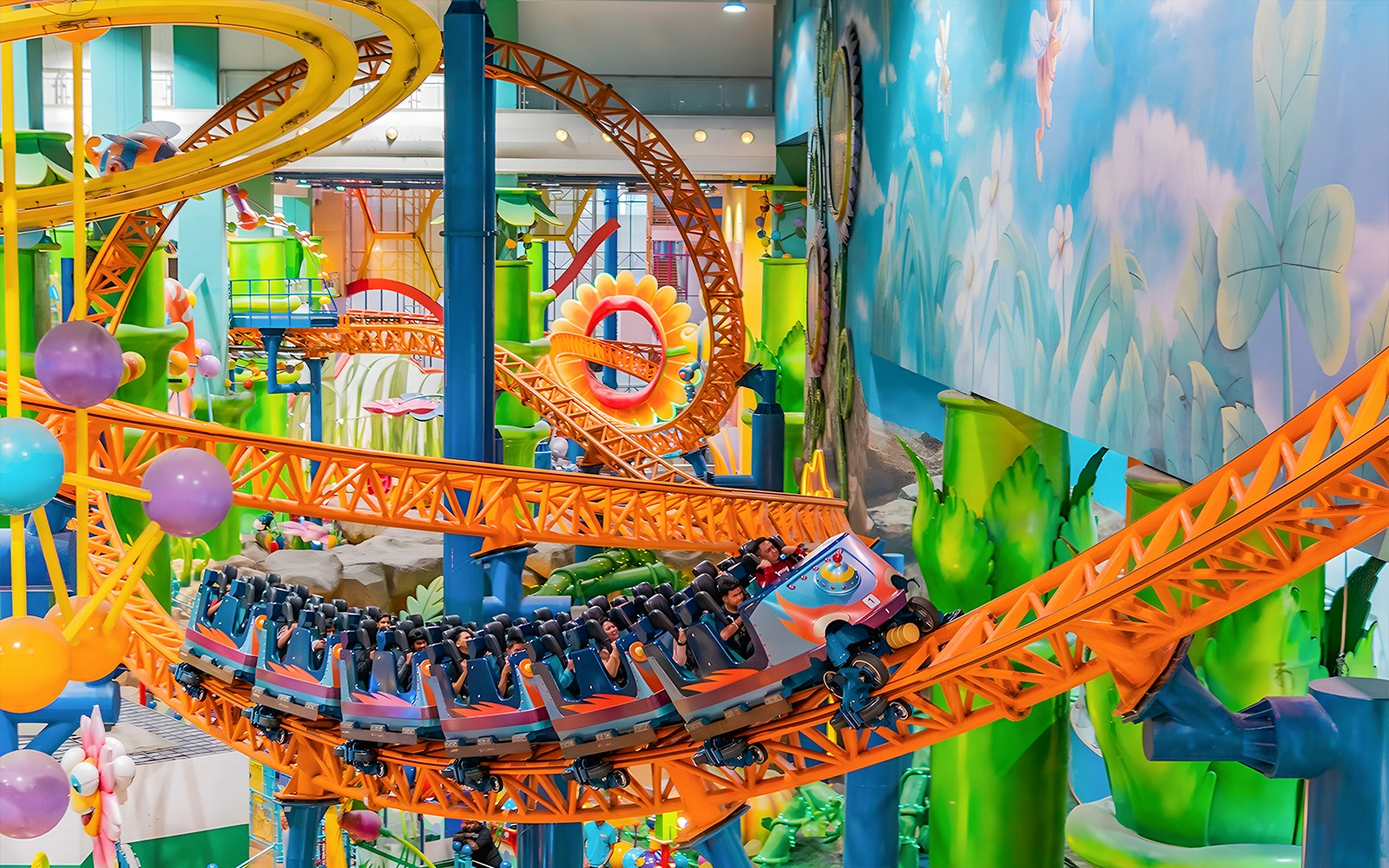 Roller coaster ride at Berjaya Times Square Theme Park with colorful loops and tracks.