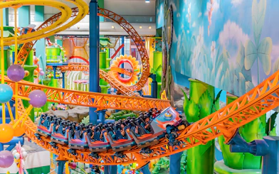 Roller coaster ride at Berjaya Times Square Theme Park with colorful loops and tracks.