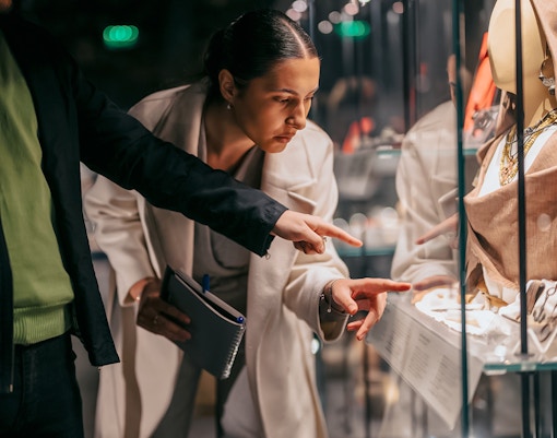 Visitors examining exhibits at Fondation Azzedine Alaïa in Paris, France.