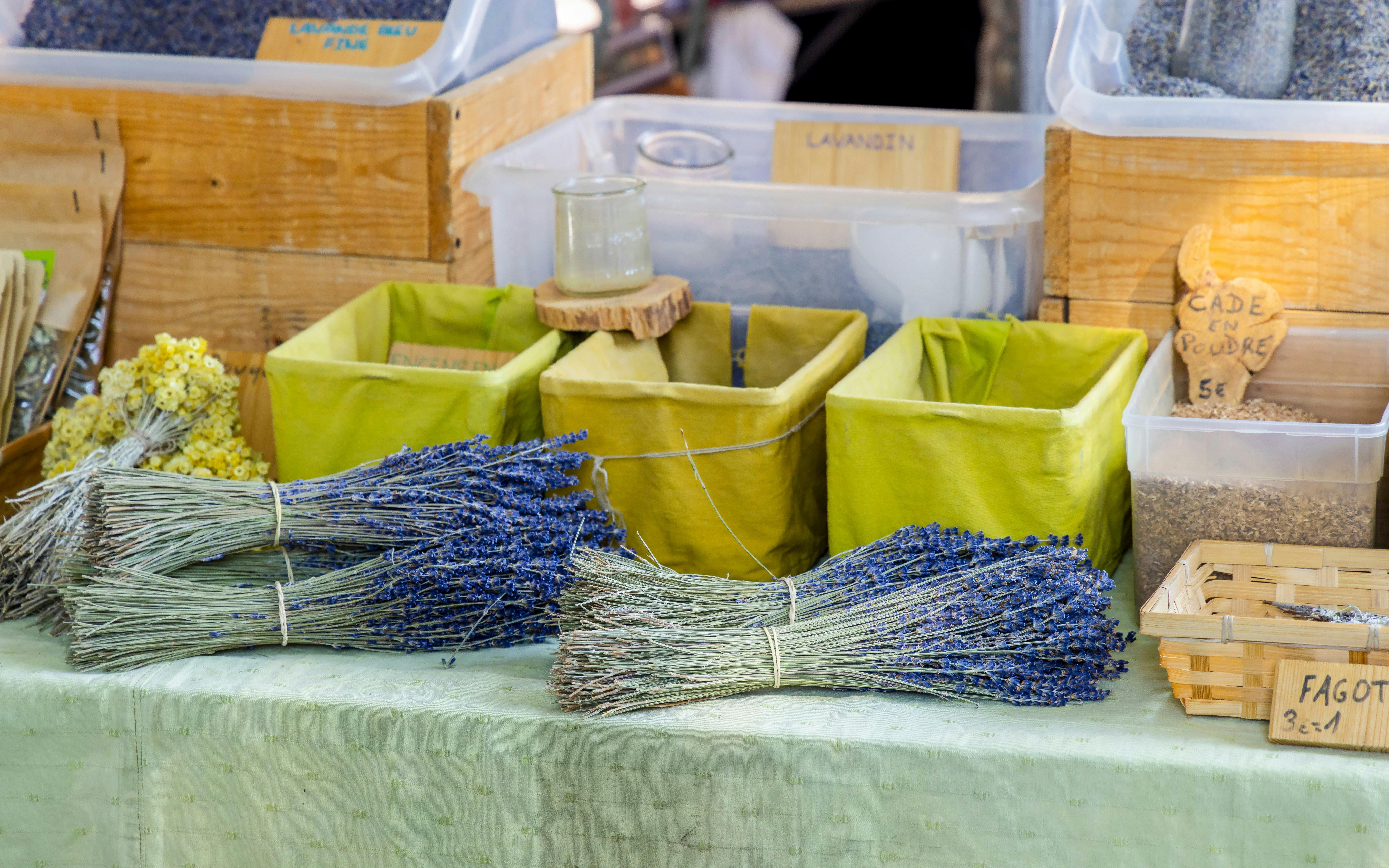Lavender bundles and herbs displayed at a local market in Provence.