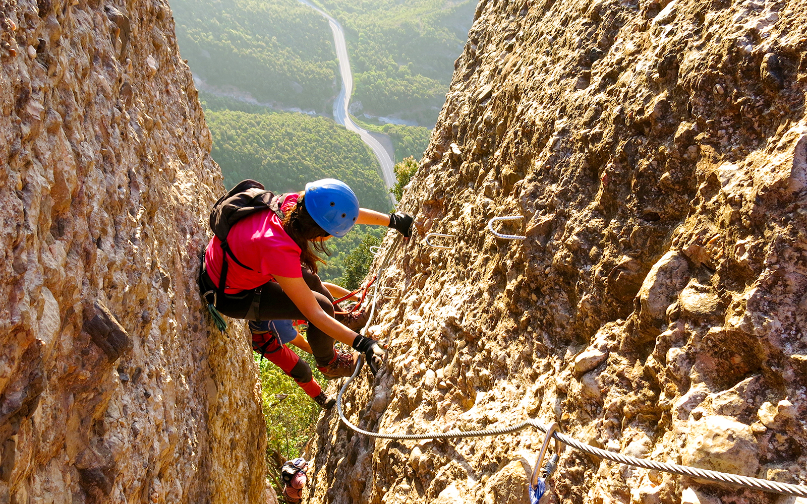 Montserrat rock climbing experience in Catalonia, Spain, showcasing climbers on rugged mountain terrain.