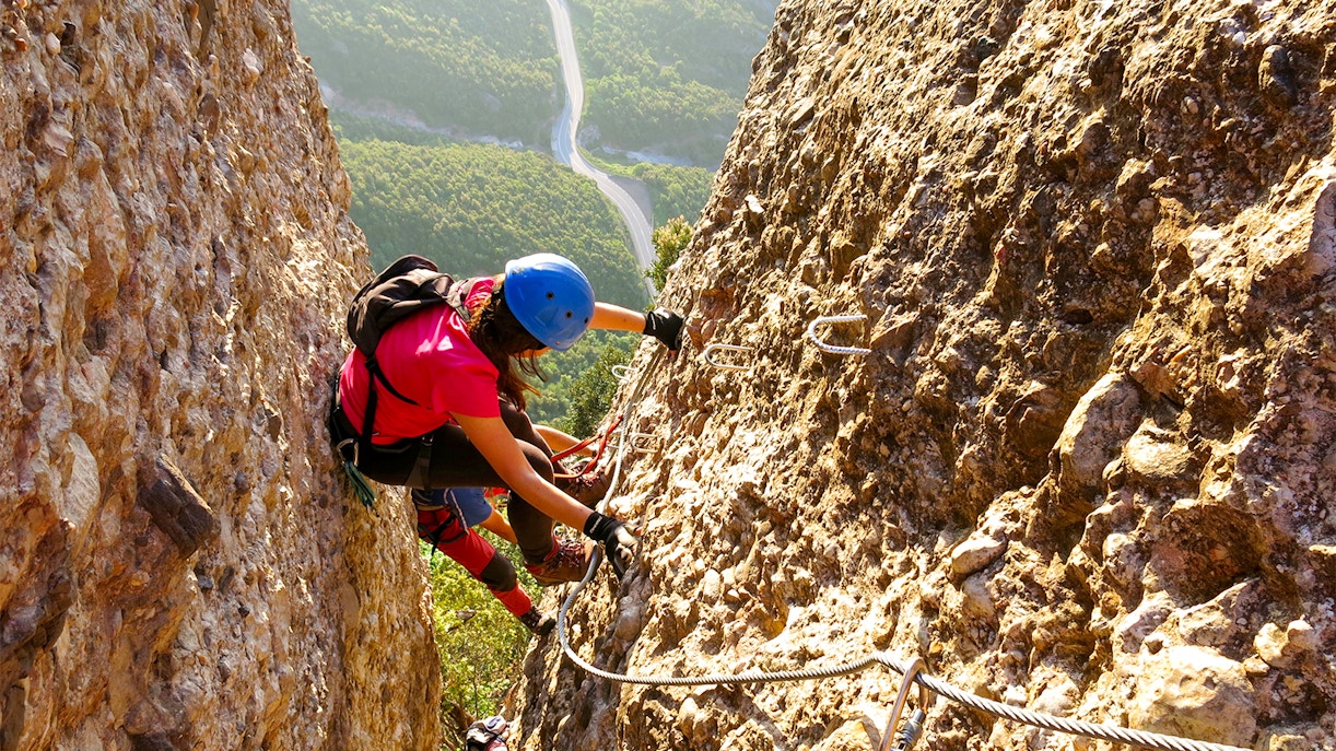 Montserrat rock climbing experience in Catalonia, Spain, showcasing climbers on rugged mountain terrain.