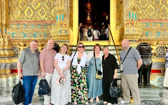 Group of tourists at the entrance of the Grand Palace, Bangkok, during a private tour.