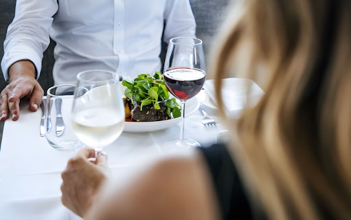 Fine dining experience on Sydney Harbour cruise with wine and gourmet meal.