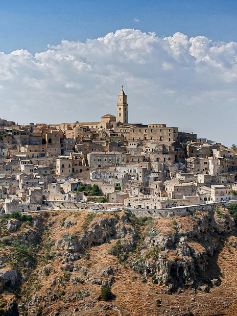Matera's ancient stone cityscape with historic churches in Murgia Park.