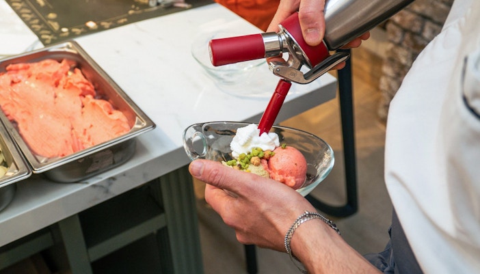 Gelato being prepared in a traditional Italian gelateria, Rome, Italy.